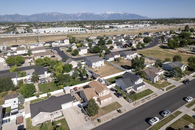 3139 S Timeron Dr, West Valley City, UT 84128 - aerial overview of property's location with a mountain backdrop and nearby suburban area