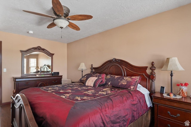3139 S Timeron Dr, West Valley City, UT 84128 - bedroom with wood finished floors, a textured ceiling, and a ceiling fan