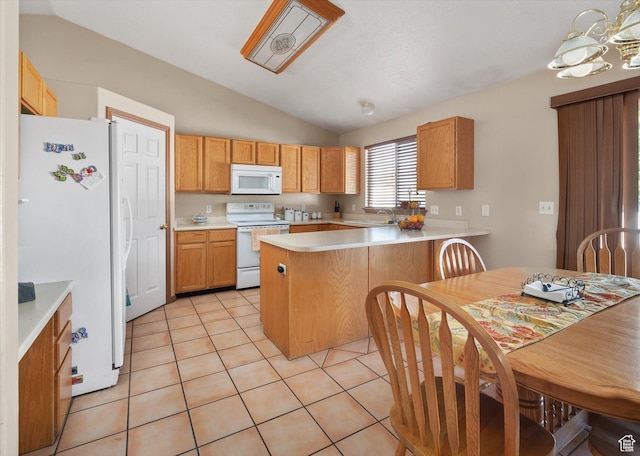 3139 S Timeron Dr, West Valley City, UT 84128 - kitchen featuring white appliances, lofted ceiling, a peninsula, light countertops, and light tile patterned floors