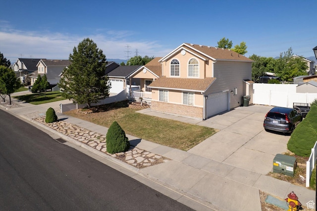 3139 S Timeron Dr, West Valley City, UT 84128 - view of front of property with concrete driveway, an attached garage, and brick siding