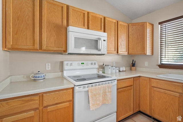 3139 S Timeron Dr, West Valley City, UT 84128 - kitchen with white appliances, vaulted ceiling, light countertops, and light tile patterned floors