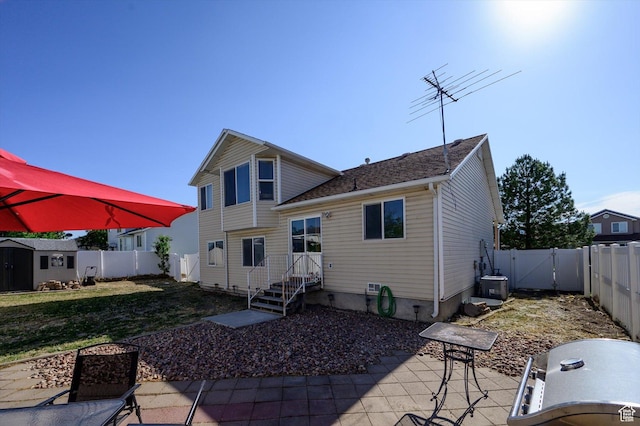 3139 S Timeron Dr, West Valley City, UT 84128 - rear view of house with a patio and a gate