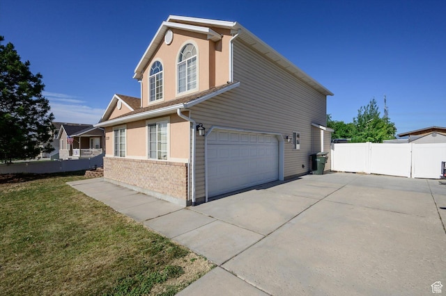 3139 S Timeron Dr, West Valley City, UT 84128 - view of side of property featuring a garage and driveway