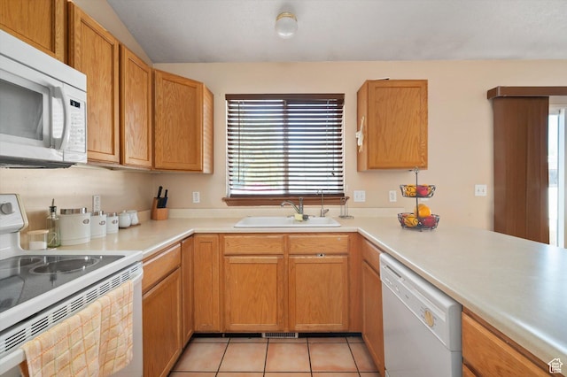 3139 S Timeron Dr, West Valley City, UT 84128 - kitchen featuring white appliances, a sink, healthy amount of natural light, and light countertops