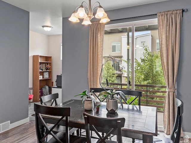 5103 W Laureston Way, Herriman, UT 84096 - dining room with wood finished floors, a chandelier, and baseboards