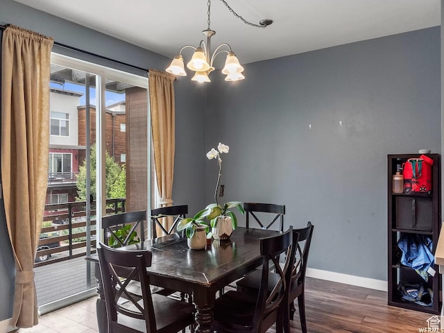 5103 W Laureston Way, Herriman, UT 84096 - dining room with a chandelier, wood finished floors, and baseboards