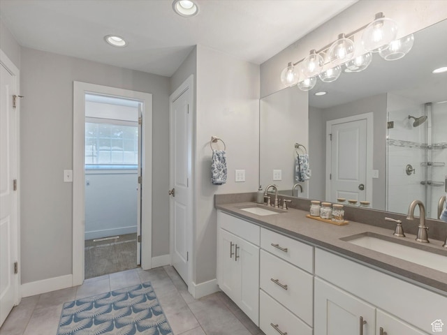 1555 E Fieldcrest Ln, Holladay, UT 84117 - bathroom with double vanity, a shower stall, tile patterned flooring, baseboards, and recessed lighting