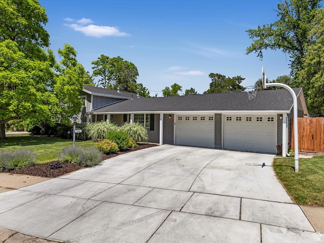 1555 E Fieldcrest Ln, Holladay, UT 84117 - view of front of property featuring an attached garage, driveway, board and batten siding, brick siding, and a shingled roof