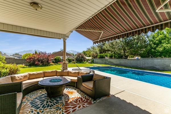 3007 W Sweet Clover Ln, South Jordan, UT 84095 - view of pool featuring an outdoor living space with a fire pit and a patio area