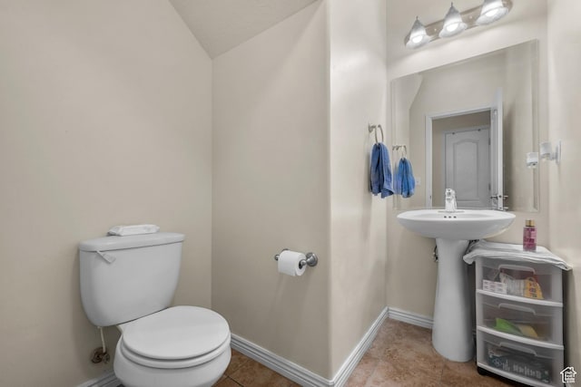 84 S 1630 W, Pleasant Grove, UT 84062 - half bath featuring toilet, baseboards, vaulted ceiling, and tile patterned floors