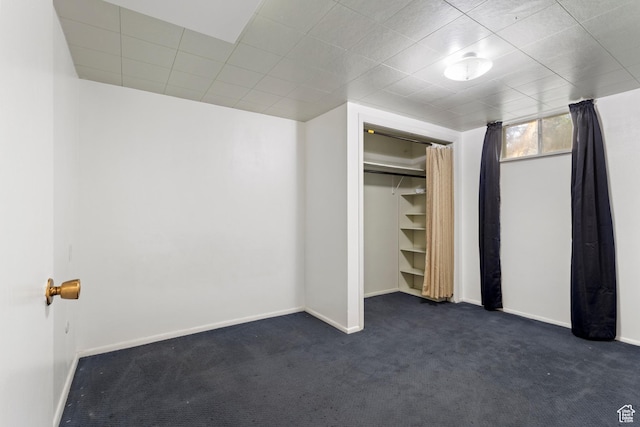335 S 600 E, Smithfield, UT 84335 - unfurnished bedroom featuring dark colored carpet, baseboards, and a closet