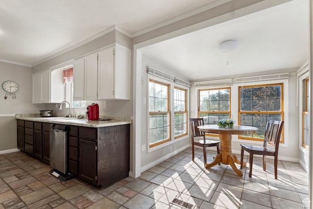 335 S 600 E, Smithfield, UT 84335 - kitchen with baseboards, stainless steel dishwasher, a sink, light countertops, and white cabinets