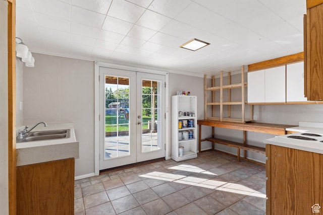 335 S 600 E, Smithfield, UT 84335 - kitchen featuring french doors, a sink, white cabinetry, light countertops, and ornamental molding