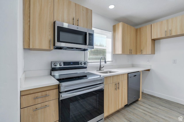 520 S Jeremy St W, Salt Lake City, UT 84104 - kitchen featuring stainless steel appliances, light brown cabinetry, a sink, light countertops, and recessed lighting