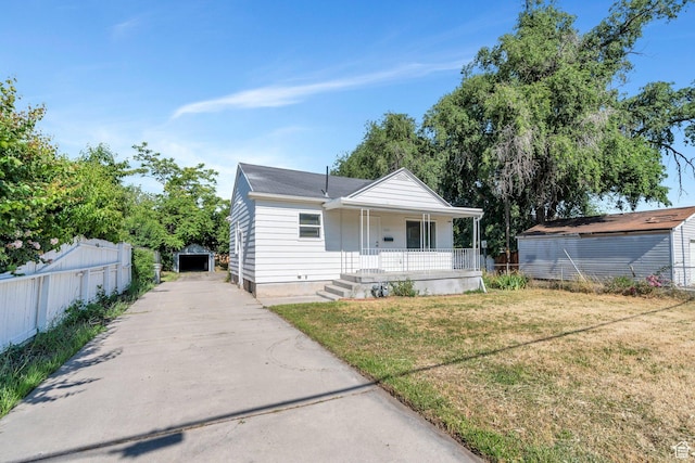520 S Jeremy St W, Salt Lake City, UT 84104 - bungalow with covered porch, an outdoor structure, crawl space, and concrete driveway