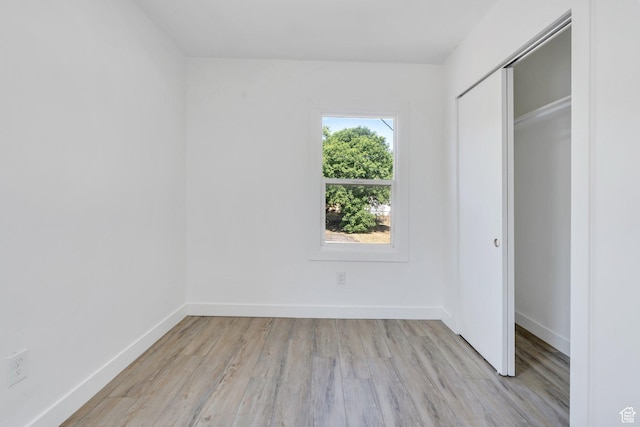 520 S Jeremy St W, Salt Lake City, UT 84104 - unfurnished bedroom with light wood-style flooring, baseboards, and a closet