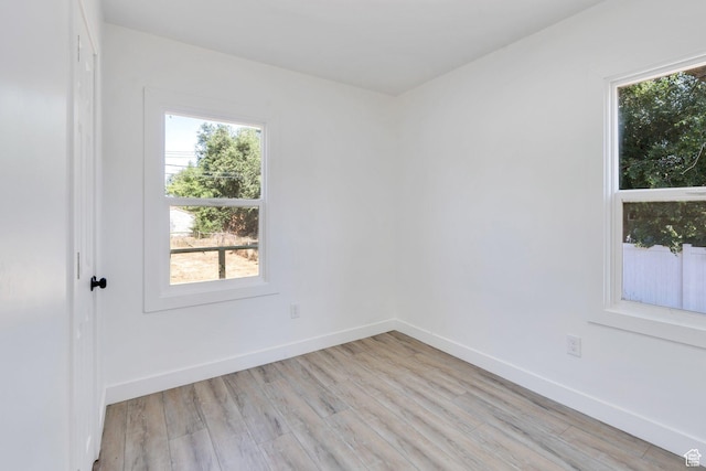 520 S Jeremy St W, Salt Lake City, UT 84104 - unfurnished room with healthy amount of natural light, light wood-type flooring, and baseboards