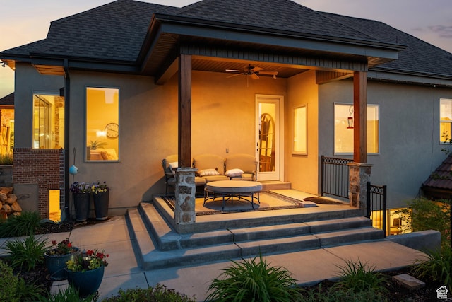1827 S Hillcrest Cir, Mapleton, UT 84664 - back of property at dusk with a shingled roof, stucco siding, and ceiling fan
