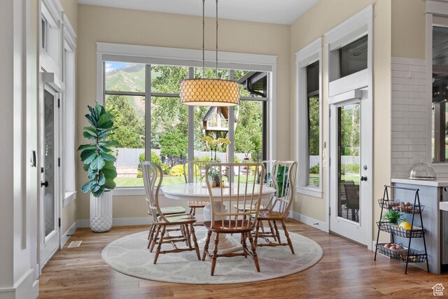 1827 S Hillcrest Cir, Mapleton, UT 84664 - dining area with plenty of natural light, wood finished floors, and baseboards