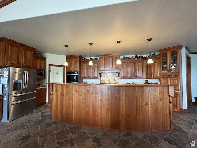 11730 E 24200 N, Fairview, UT 84629 - kitchen with appliances with stainless steel finishes, brown cabinets, glass insert cabinets, and dark stone finish floors