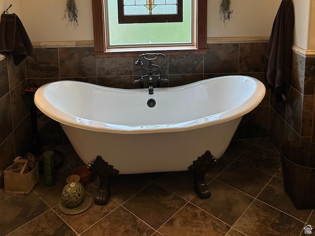 11730 E 24200 N, Fairview, UT 84629 - bathroom featuring tile walls, a soaking tub, and a wainscoted wall