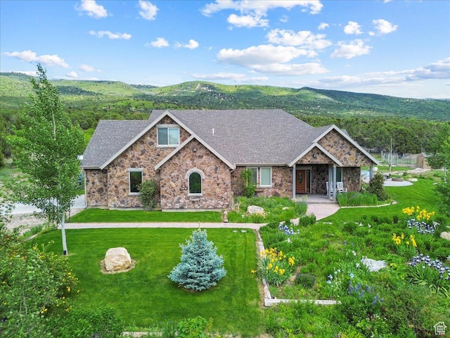 11730 E 24200 N, Fairview, UT 84629 - view of front of house with stone siding, a front yard, a mountain view, and roof with shingles