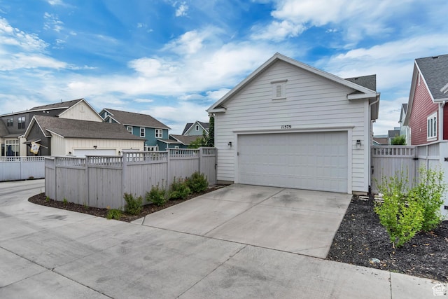 11579 S Pebble Pond Rd, South Jordan, UT 84009 - view of property exterior with a residential view, driveway, and a garage