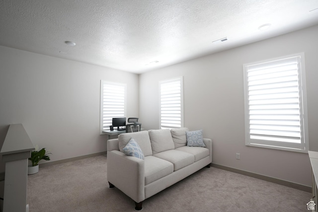11579 S Pebble Pond Rd, South Jordan, UT 84009 - carpeted living room with a desk, a textured ceiling, and baseboards