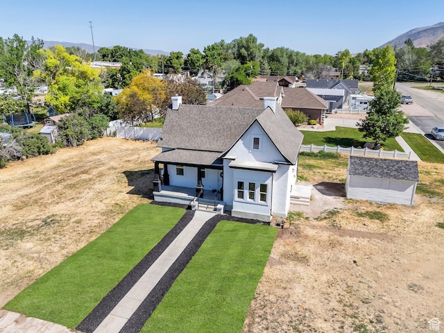 195 E 200 S, Nephi, UT 84648 - view of front of property with a shingled roof, stucco siding, a porch, and a mountain view
