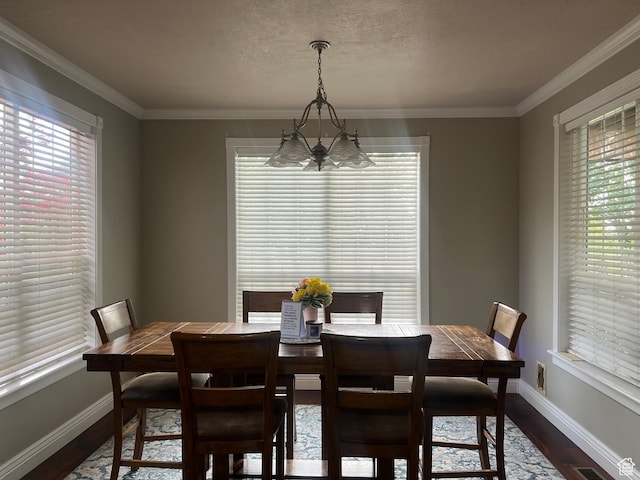 1107 E 1625 N, North Logan, UT 84341 - dining area with a chandelier, dark wood-style floors, plenty of natural light, baseboards, and ornamental molding