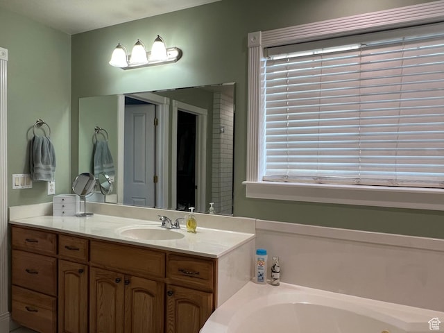 1107 E 1625 N, North Logan, UT 84341 - bathroom with a whirlpool tub, vanity, and healthy amount of natural light