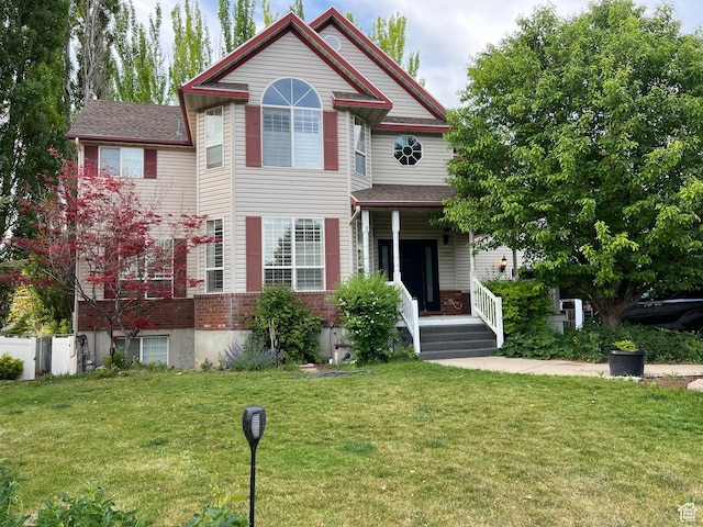 1107 E 1625 N, North Logan, UT 84341 - victorian house with a front lawn and a porch