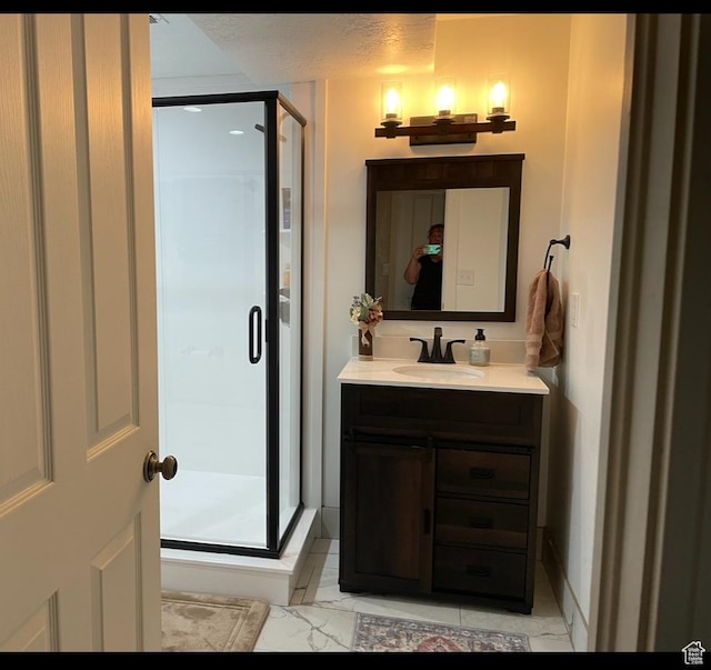 1107 E 1625 N, North Logan, UT 84341 - bathroom with vanity, a stall shower, and marble look tile flooring