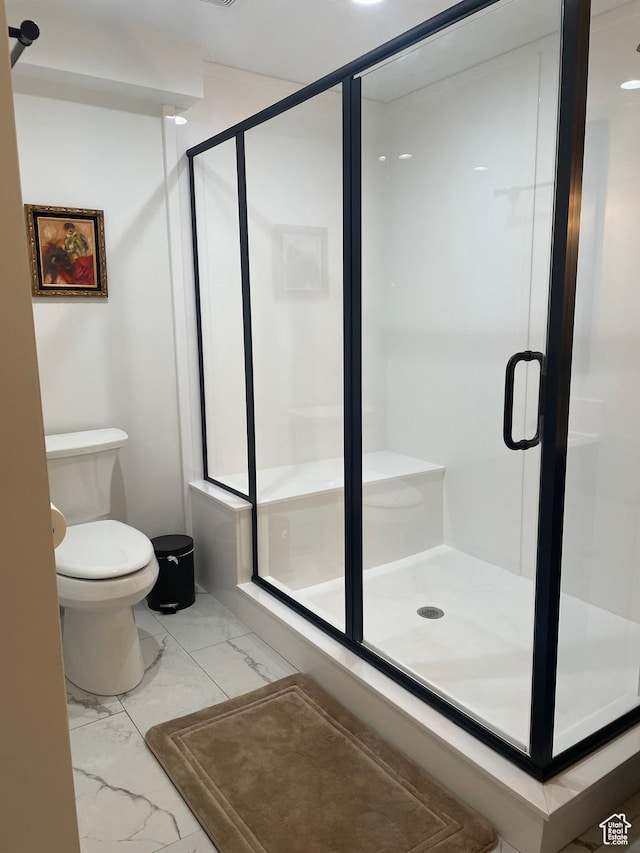 1107 E 1625 N, North Logan, UT 84341 - bathroom with marble look tile flooring, toilet, and a shower stall