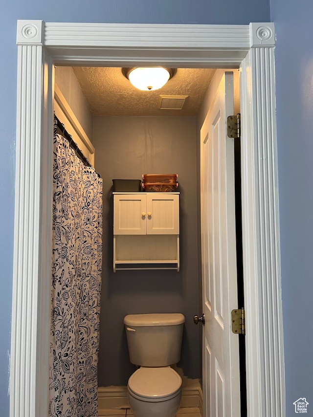 1107 E 1625 N, North Logan, UT 84341 - full bathroom with toilet and a textured ceiling
