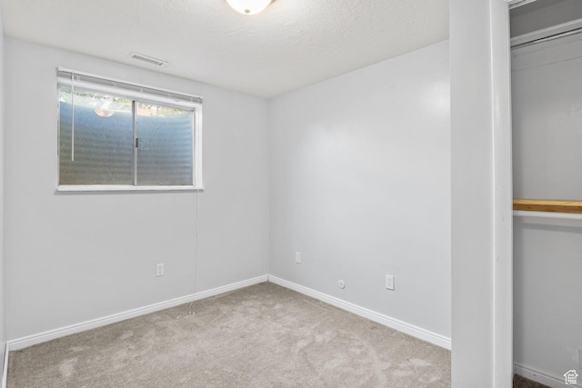 1522 W 1200 N, Layton, UT 84041 - unfurnished bedroom with carpet, baseboards, and a textured ceiling