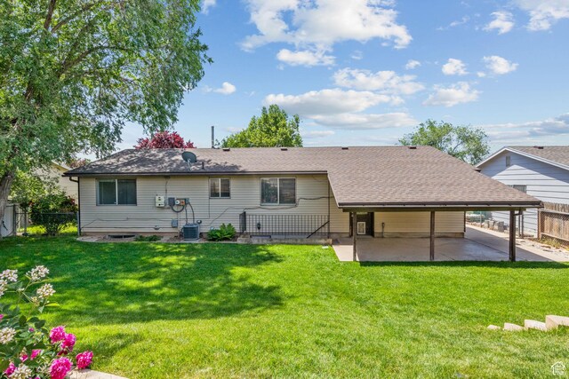 1522 W 1200 N, Layton, UT 84041 - rear view of house featuring a patio, a shingled roof, central AC, and a carport
