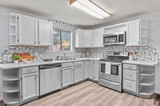 1522 W 1200 N, Layton, UT 84041 - kitchen featuring open shelves, stainless steel appliances, and a textured ceiling