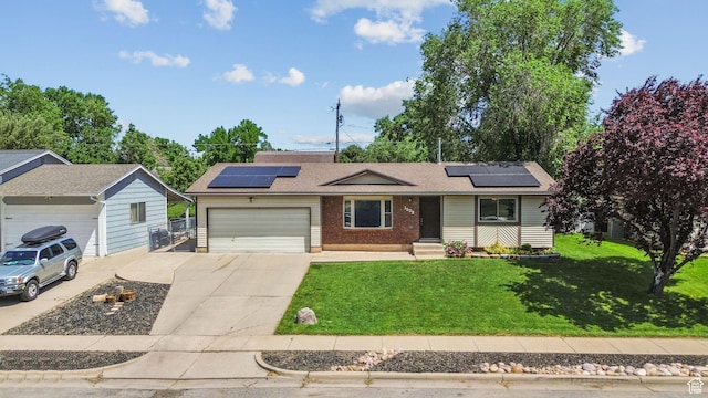 1522 W 1200 N, Layton, UT 84041 - ranch-style house featuring a garage, driveway, a front lawn, and solar panels