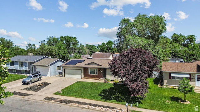 1522 W 1200 N, Layton, UT 84041 - view of front of house with driveway, a front yard, roof mounted solar panels, and a garage