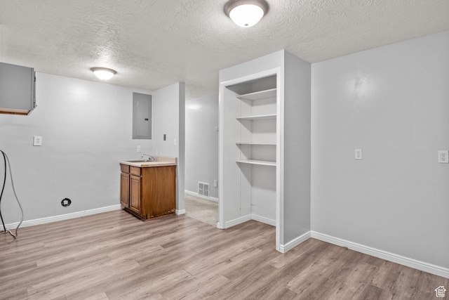 1522 W 1200 N, Layton, UT 84041 - basement with a textured ceiling, light wood-style floors, baseboards, and electric panel