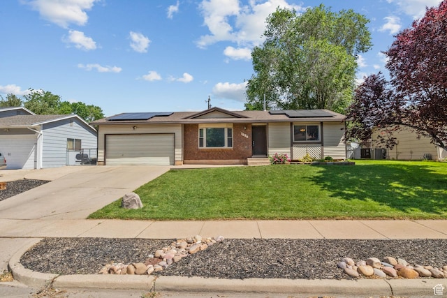 1522 W 1200 N, Layton, UT 84041 - single story home featuring an attached garage, driveway, a front yard, roof mounted solar panels, and brick siding
