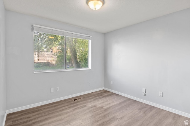 1522 W 1200 N, Layton, UT 84041 - spare room featuring wood finished floors and baseboards