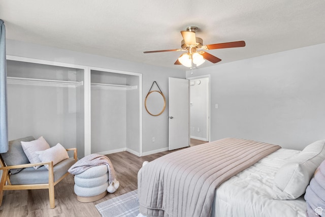 1522 W 1200 N, Layton, UT 84041 - bedroom with wood finished floors, ceiling fan, a closet, and baseboards