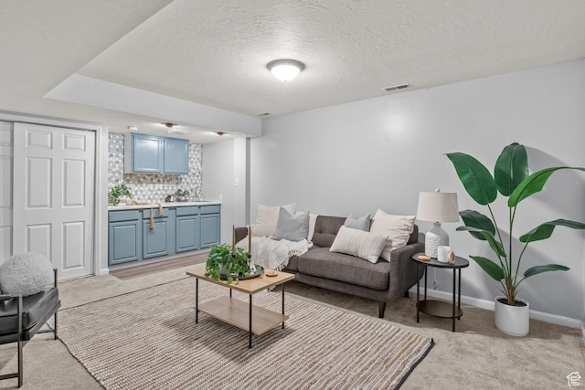 1522 W 1200 N, Layton, UT 84041 - living area with light carpet, a textured ceiling, and baseboards