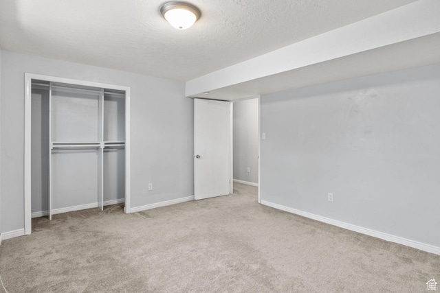 1522 W 1200 N, Layton, UT 84041 - unfurnished bedroom featuring a textured ceiling, carpet flooring, baseboards, and a closet