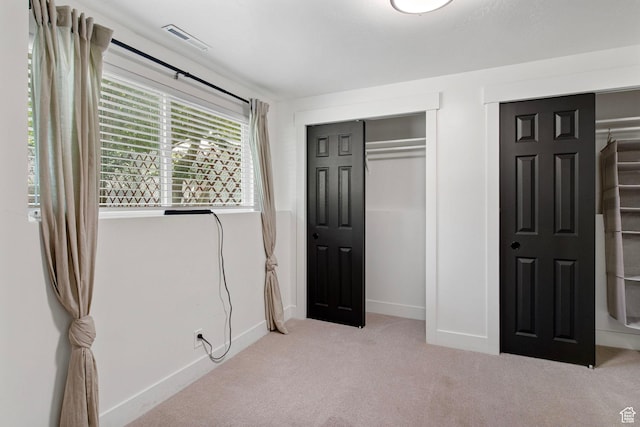 8485 S 1575 E, Sandy, UT 84093 - unfurnished bedroom featuring carpet flooring, baseboards, and multiple closets