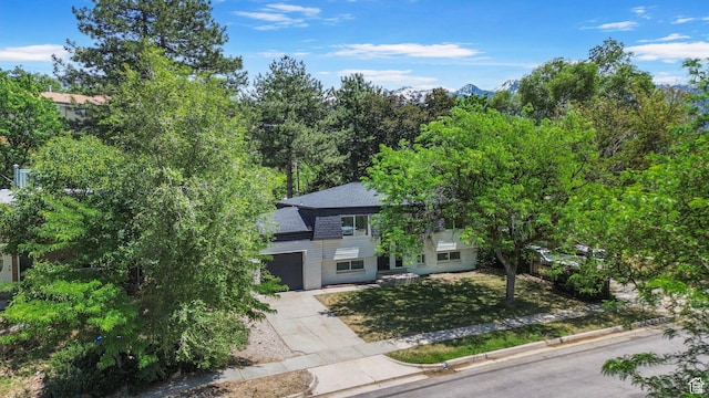 8485 S 1575 E, Sandy, UT 84093 - view of front of house with concrete driveway, a garage, a shingled roof, and a front yard