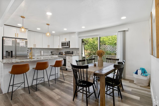 8485 S 1575 E, Sandy, UT 84093 - dining room with light wood-type flooring and recessed lighting