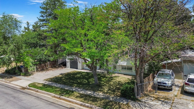 8485 S 1575 E, Sandy, UT 84093 - obstructed view of property featuring concrete driveway and a garage